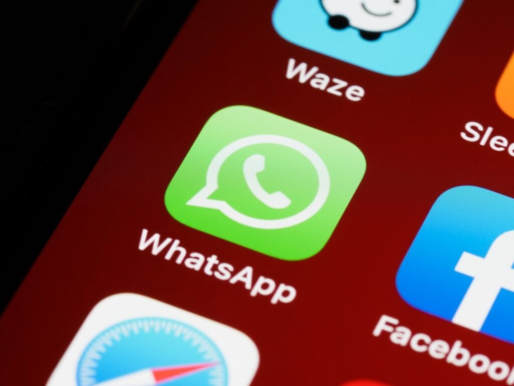 WhatsApp app icon on an iPhone home screen — used for ordering water delivery in Multan